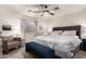 Cozy main bedroom featuring a ceiling fan, a sitting area and a luxurious bed at 21860 N 41St St, Phoenix, AZ 85050