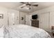 Spacious main bedroom with a dresser, sliding closet doors, and an ensuite bathroom at 21860 N 41St St, Phoenix, AZ 85050