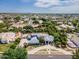 Aerial view showcasing a luxury home with lush landscaping, a circular driveway, and a desirable neighborhood at 2251 N 32Nd St # 31, Mesa, AZ 85213