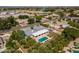 Aerial view of a luxury home featuring a large pool, covered patio, and mature trees in a desirable neighborhood at 2251 N 32Nd St # 31, Mesa, AZ 85213