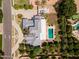 Aerial view of a luxury home with a large backyard, beautiful pool, and circular driveway, showcasing its expansive property at 2251 N 32Nd St # 31, Mesa, AZ 85213