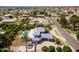 Stunning aerial view of home with a gray roof, a pool, palm trees, and a well-maintained yard in a lush neighborhood at 2251 N 32Nd St # 31, Mesa, AZ 85213