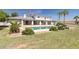 Exterior featuring a backyard pool and patio area with lush landscaping and a two-story home at 2251 N 32Nd St # 31, Mesa, AZ 85213