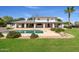 Expansive backyard with a sparkling pool, manicured lawn, and covered patio area perfect for outdoor living at 2251 N 32Nd St # 31, Mesa, AZ 85213