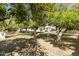 Lush backyard filled with mature fruit trees, offering shade and privacy, creating a serene outdoor retreat at 2251 N 32Nd St # 31, Mesa, AZ 85213
