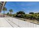 Balcony with scenic views of the pool, palm trees, and surrounding lush landscape, offering an outdoor retreat at 2251 N 32Nd St # 31, Mesa, AZ 85213