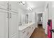 Bathroom showcasing dual sinks, modern fixtures, and access to other rooms at 2251 N 32Nd St # 31, Mesa, AZ 85213
