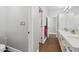 Bathroom showcasing modern fixtures, dual sinks, and access to other rooms at 2251 N 32Nd St # 31, Mesa, AZ 85213