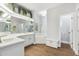 Bright bathroom showcasing a soaking tub, large mirror, dual sinks and ample cabinet space at 2251 N 32Nd St # 31, Mesa, AZ 85213
