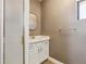 This bathroom features a vanity with white cabinets and a shower with white tile at 2251 N 32Nd St # 31, Mesa, AZ 85213