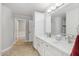 A bathroom with a double sink vanity, quartz countertops, and storage cabinets at 2251 N 32Nd St # 31, Mesa, AZ 85213