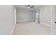 Minimalist bedroom featuring neutral paint, carpet, a window and dark door at 2251 N 32Nd St # 31, Mesa, AZ 85213