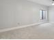 Neutral bedroom with plush carpeting, a window, and ample space at 2251 N 32Nd St # 31, Mesa, AZ 85213