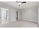 This is a bedroom with neutral colored carpet, ceiling fan, and a spacious ensuite at 2251 N 32Nd St # 31, Mesa, AZ 85213
