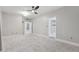 Spacious bedroom with plush carpeting, a ceiling fan, and multiple doorways at 2251 N 32Nd St # 31, Mesa, AZ 85213