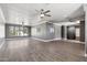 Spacious bonus room with wood-look flooring, ample natural light, and multiple ceiling fans at 2251 N 32Nd St # 31, Mesa, AZ 85213