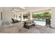 Spacious covered patio with dining area adjacent to the pool, ideal for outdoor gatherings and relaxation at 2251 N 32Nd St # 31, Mesa, AZ 85213