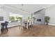 Bright dining area featuring fireplace and an oversized window with backyard views at 2251 N 32Nd St # 31, Mesa, AZ 85213