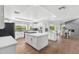 Open concept kitchen features a large island and breakfast area with a stone fireplace at 2251 N 32Nd St # 31, Mesa, AZ 85213
