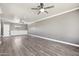 Spacious living room features hardwood floors, neutral paint, and a ceiling fan at 2251 N 32Nd St # 31, Mesa, AZ 85213