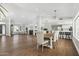 Large, open living room with hardwood floors, multiple seating areas, and kitchen access at 2251 N 32Nd St # 31, Mesa, AZ 85213