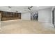 Open living space showcasing built-in shelving, a staircase, and tile flooring at 2251 N 32Nd St # 31, Mesa, AZ 85213