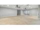 Open living space with sleek ceiling fans, recessed lights, and neutral tile flooring at 2251 N 32Nd St # 31, Mesa, AZ 85213