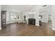 Spacious living room with hardwood floors, piano, and bright natural light at 2251 N 32Nd St # 31, Mesa, AZ 85213