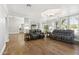 Sitting area features hardwood floors, gray sofas, and paneled windows at 2251 N 32Nd St # 31, Mesa, AZ 85213