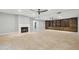 Bright living room boasts a fireplace, built-in shelving, and spacious design at 2251 N 32Nd St # 31, Mesa, AZ 85213