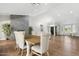 Open-concept living room features a modern fireplace and wood floors at 2251 N 32Nd St # 31, Mesa, AZ 85213