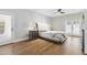 Serene main bedroom with hardwood floors, ceiling fan and neutral decor at 2251 N 32Nd St # 31, Mesa, AZ 85213