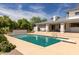 Backyard pool featuring a diving board and lush landscaping at 2251 N 32Nd St # 31, Mesa, AZ 85213