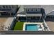 Aerial view of a backyard with a pool, hot tub, covered patio, and outdoor seating at 22752 E Arroyo Verde Dr, Queen Creek, AZ 85142