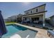 Relax in this backyard with a hot tub and a large swimming pool at 22752 E Arroyo Verde Dr, Queen Creek, AZ 85142