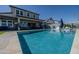 View of the house from the large pool area, with hot tub and outdoor dining at 22752 E Arroyo Verde Dr, Queen Creek, AZ 85142