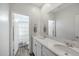 Modern bathroom with double vanity, white countertops, and a separate toilet room at 22752 E Arroyo Verde Dr, Queen Creek, AZ 85142