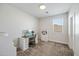 Bright bedroom with a desk and chair by the window, and white drawers for storage at 22752 E Arroyo Verde Dr, Queen Creek, AZ 85142