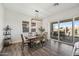 Elegant dining room with sliding glass doors to a backyard entertainment and pool area at 22752 E Arroyo Verde Dr, Queen Creek, AZ 85142