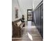 Inviting entryway features a wood bench, stylish flooring, and striking dark wainscoting at 22752 E Arroyo Verde Dr, Queen Creek, AZ 85142