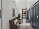 Charming entryway featuring a rustic bench, sleek wood floors, and dark wainscoting at 22752 E Arroyo Verde Dr, Queen Creek, AZ 85142