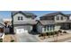 Charming two-story home with a manicured lawn, a two-car garage, and an inviting entrance at 22752 E Arroyo Verde Dr, Queen Creek, AZ 85142