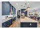 Modern kitchen featuring custom blue cabinets, white countertops and stainless steel appliances at 22752 E Arroyo Verde Dr, Queen Creek, AZ 85142