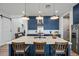 Well-lit kitchen featuring custom blue cabinets, a large island, stainless steel appliances at 22752 E Arroyo Verde Dr, Queen Creek, AZ 85142