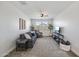 Inviting living room with neutral tones, comfortable seating, and a ceiling fan, creating a relaxed atmosphere at 22752 E Arroyo Verde Dr, Queen Creek, AZ 85142