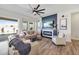 Stylish living room with a cozy fireplace and modern decor, creating a welcoming atmosphere at 22752 E Arroyo Verde Dr, Queen Creek, AZ 85142