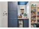 Well-organized pantry with custom shelving, storage, and beverage cooler at 22752 E Arroyo Verde Dr, Queen Creek, AZ 85142
