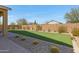 Spacious backyard with artificial turf and low-maintenance desert landscaping at 24738 N 175Th Ave, Surprise, AZ 85387