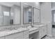 Elegant bathroom featuring dual vanities, granite countertops, and modern fixtures at 24738 N 175Th Ave, Surprise, AZ 85387