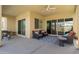 Relaxing covered patio with ceiling fan, comfortable seating, and outdoor living space at 24738 N 175Th Ave, Surprise, AZ 85387